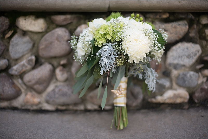 gold and ivory wedding bouquet with greenery