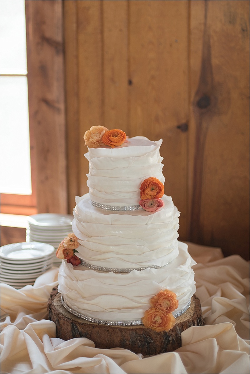 rustic orange floral wedding cake