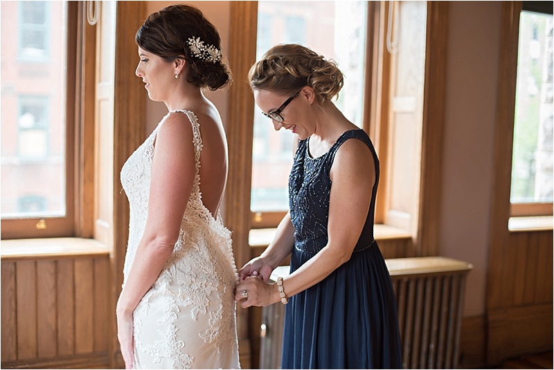low back lace wedding dress and navy bridesmaid dress