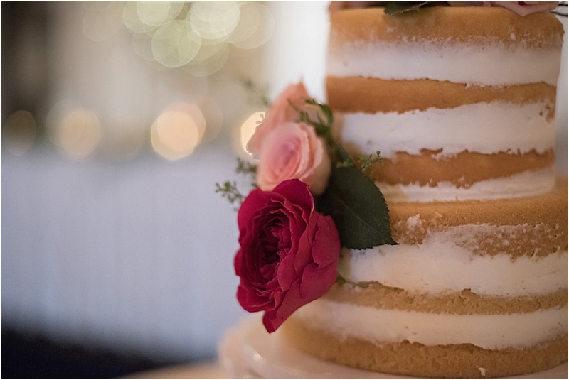 blush rose accent on unfrosted wedding cake