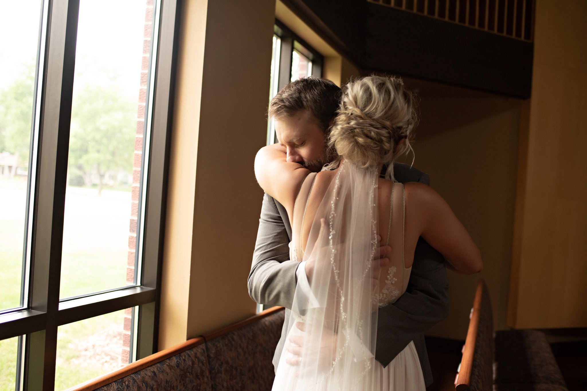 groom overwhelmed with emotion when seeing his bride