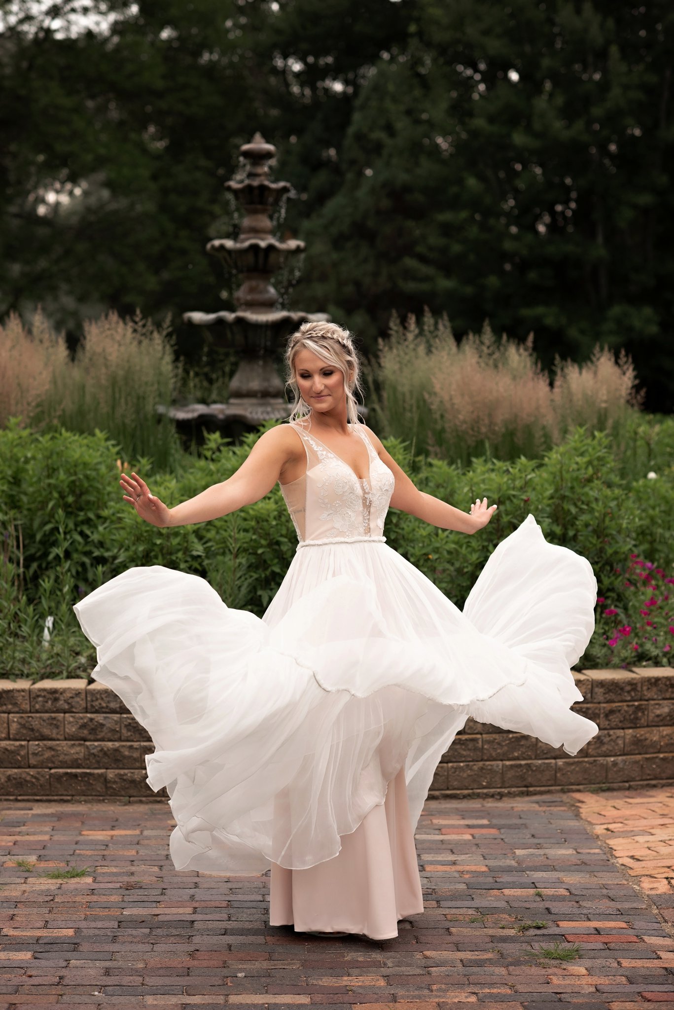 brides flowy dress spins in the air
