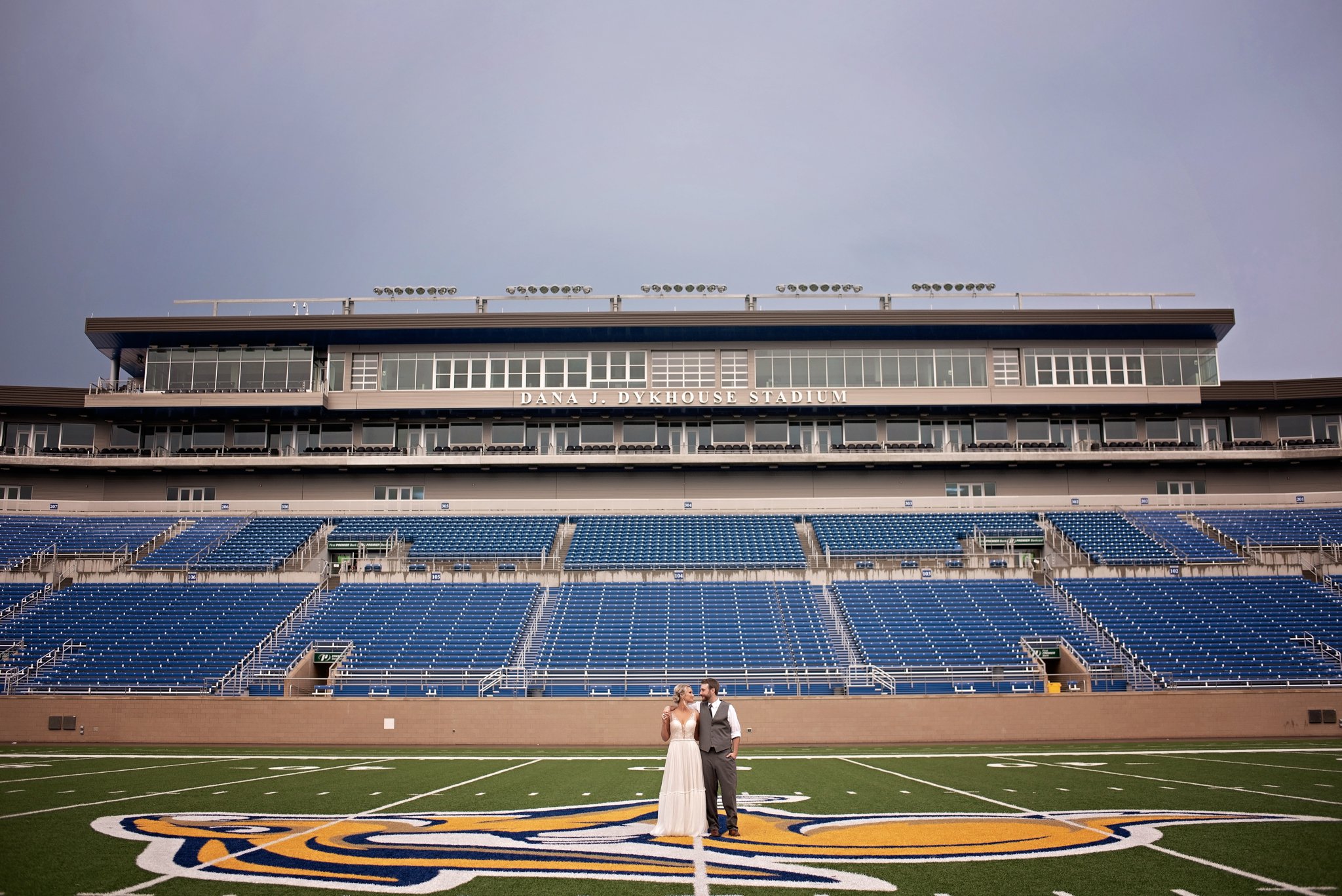 bride and groom in Dana Dykehouse stadium
