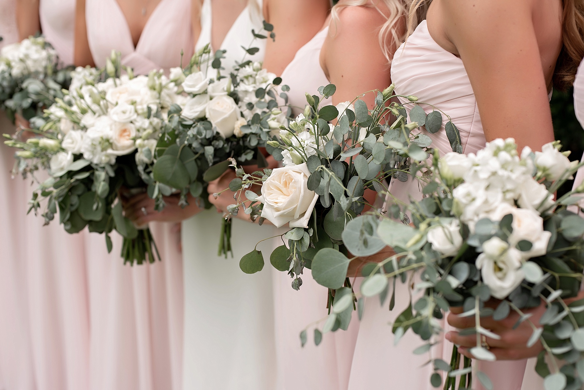 blush bridesmaid dresses with white florals