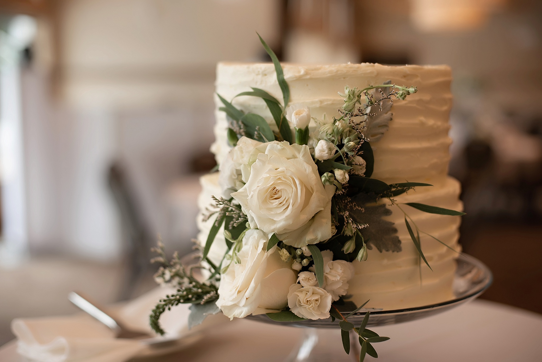 white textured cake with white florals the country club of sioux falls