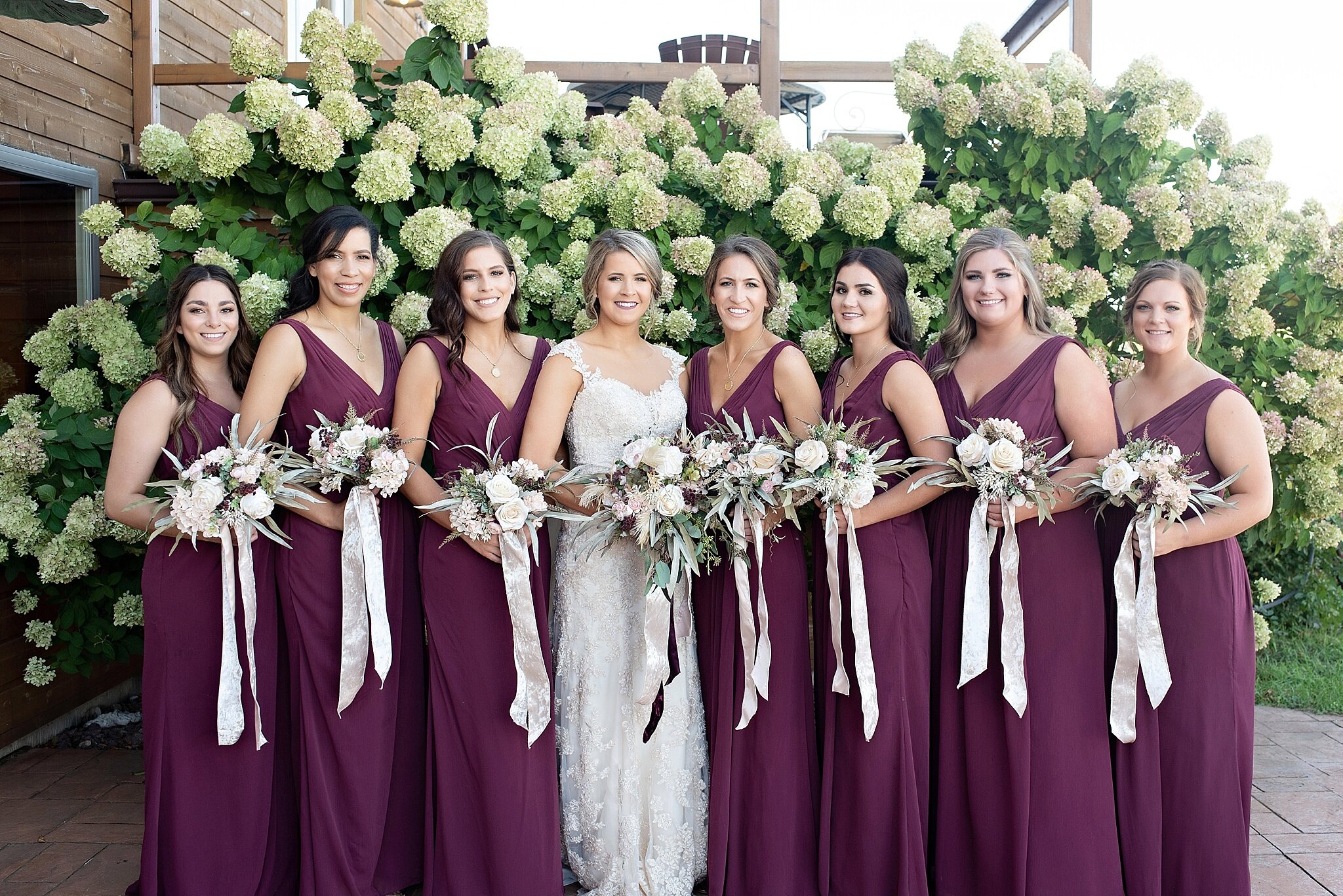 burgundy matching bridesmaid dresses with blush florals