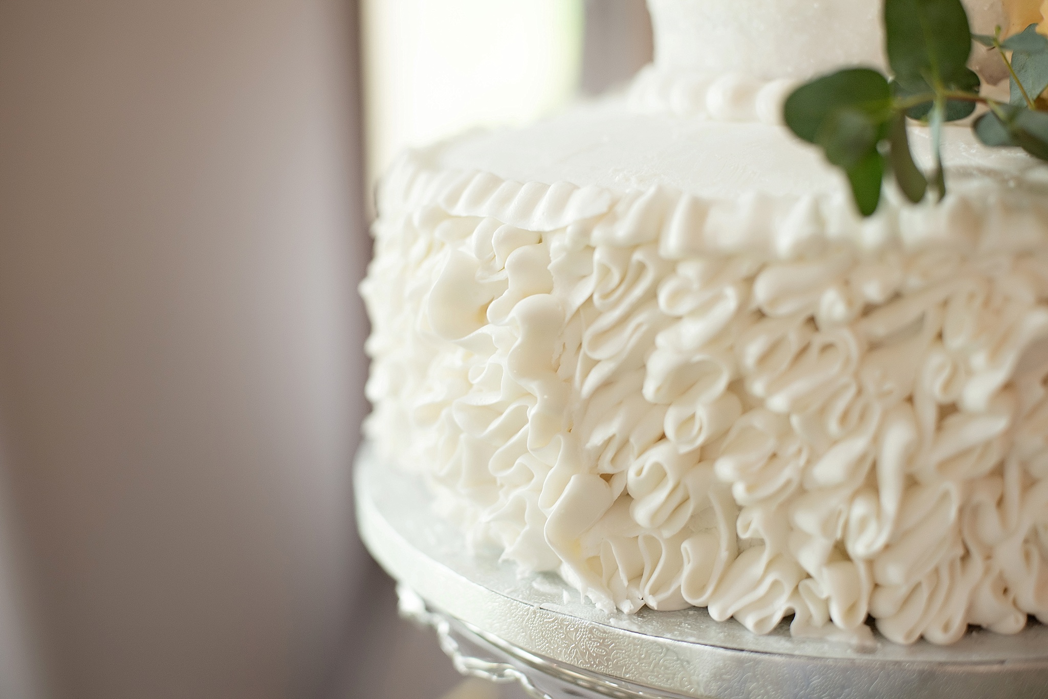 ruffle frosting on white wedding cake