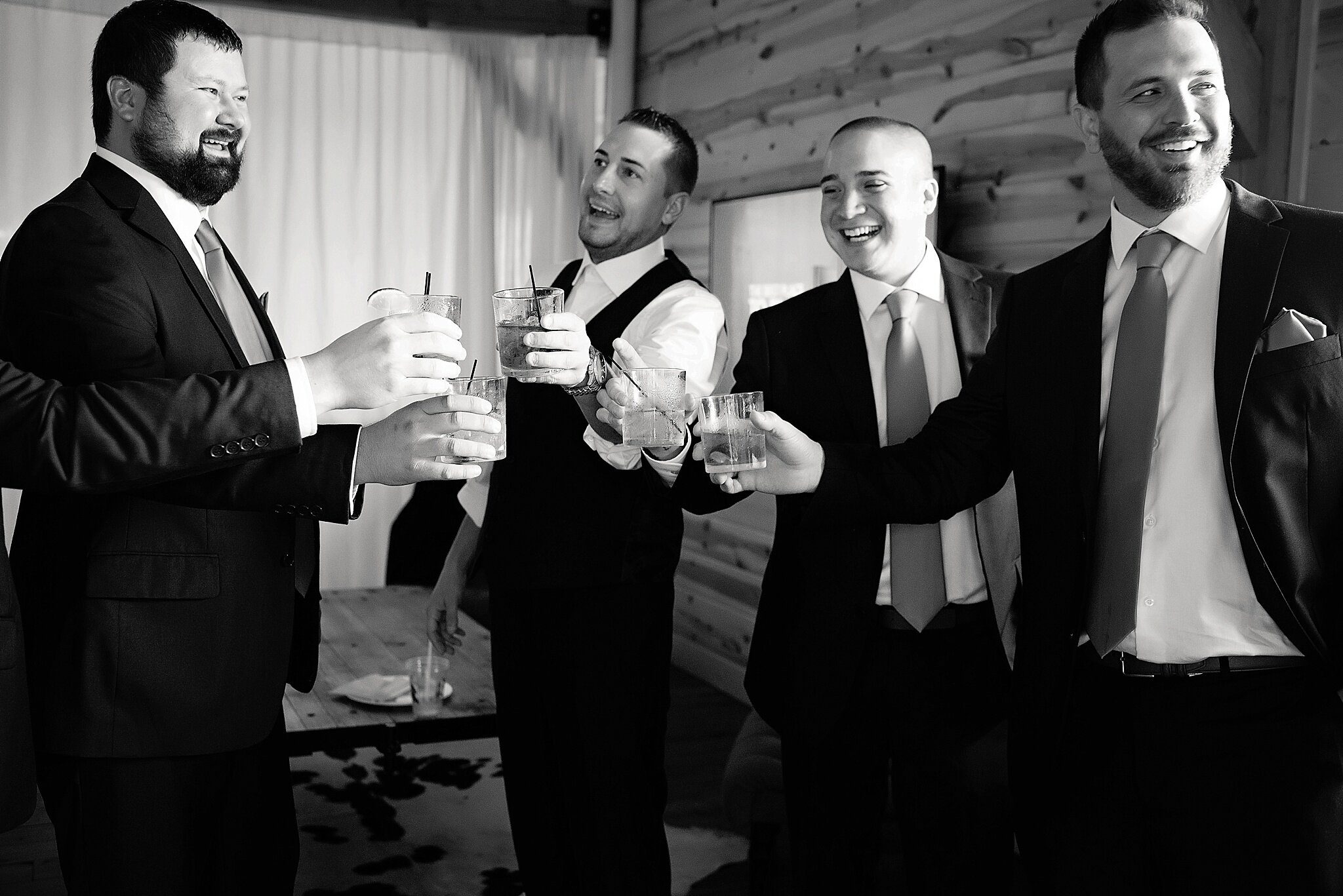 groomsmen have a drink before the ceremony