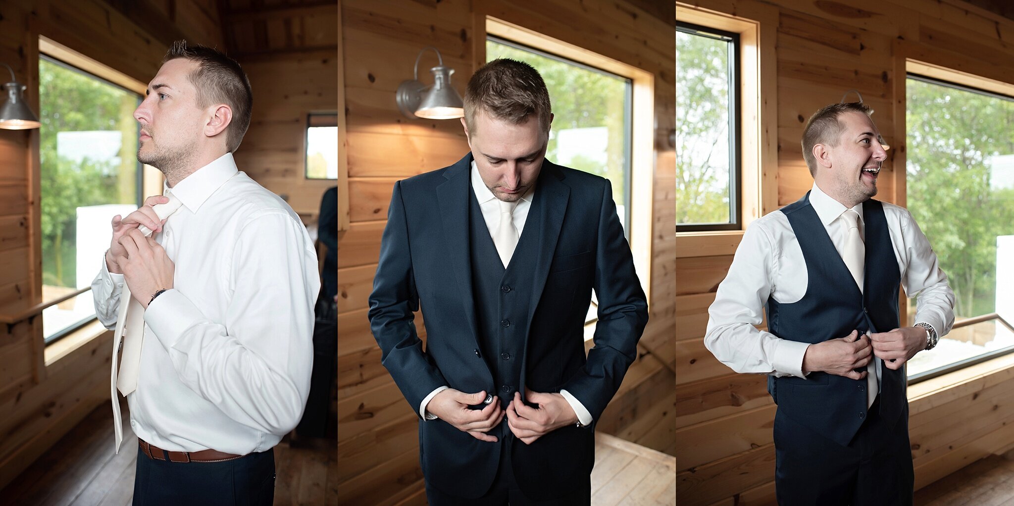 groom gets ready in navy three piece suit with ivory tie