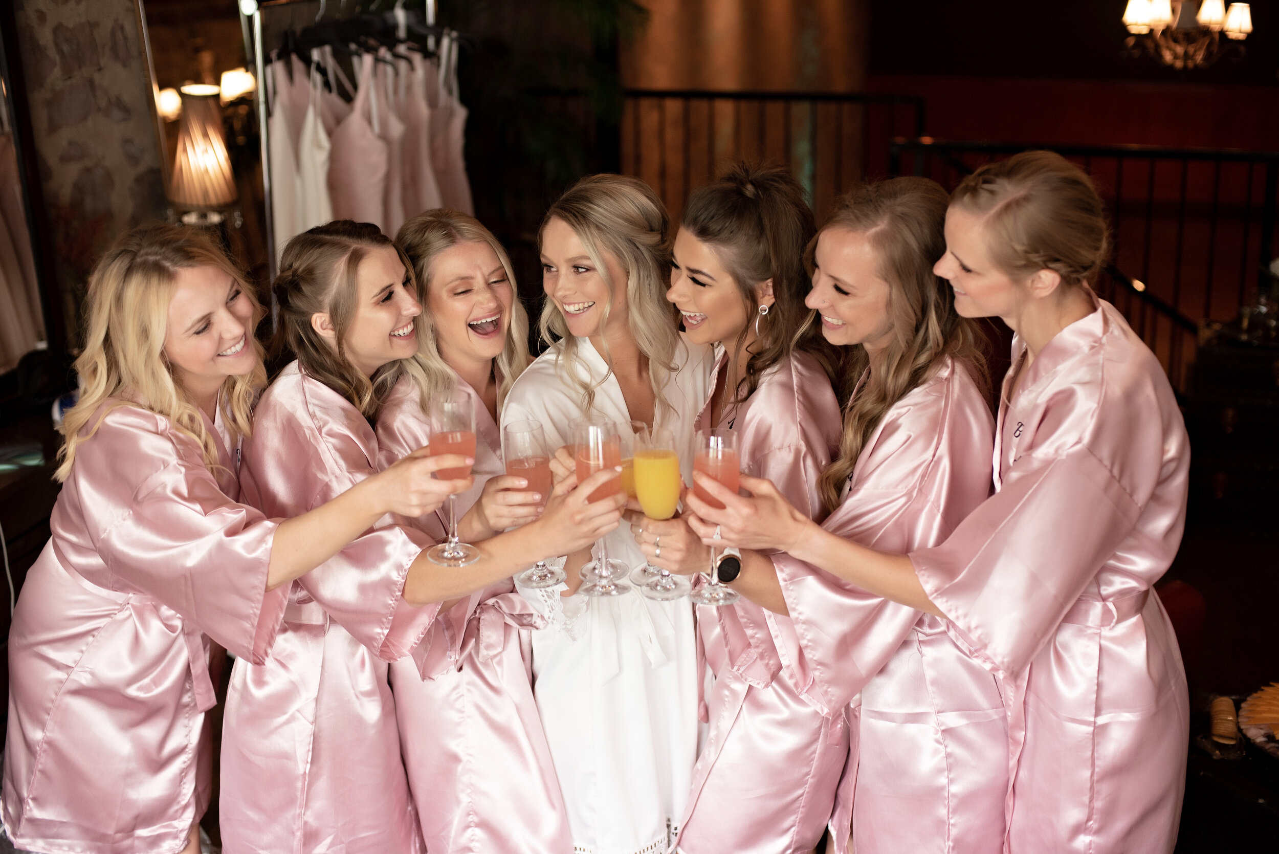 sioux falls wedding photographer kate jones studios bridesmaids celebrate with bride mimosas