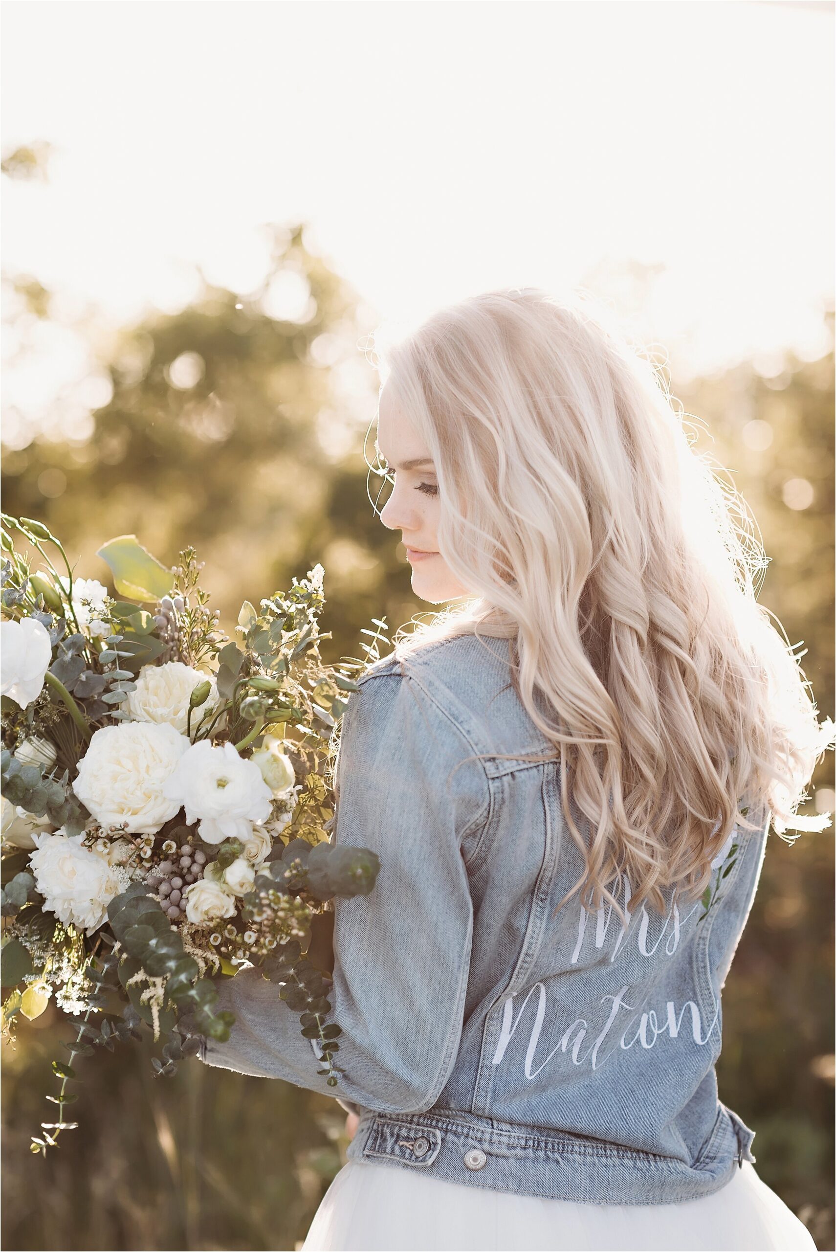 sunset with bride in personalized jean jacket
