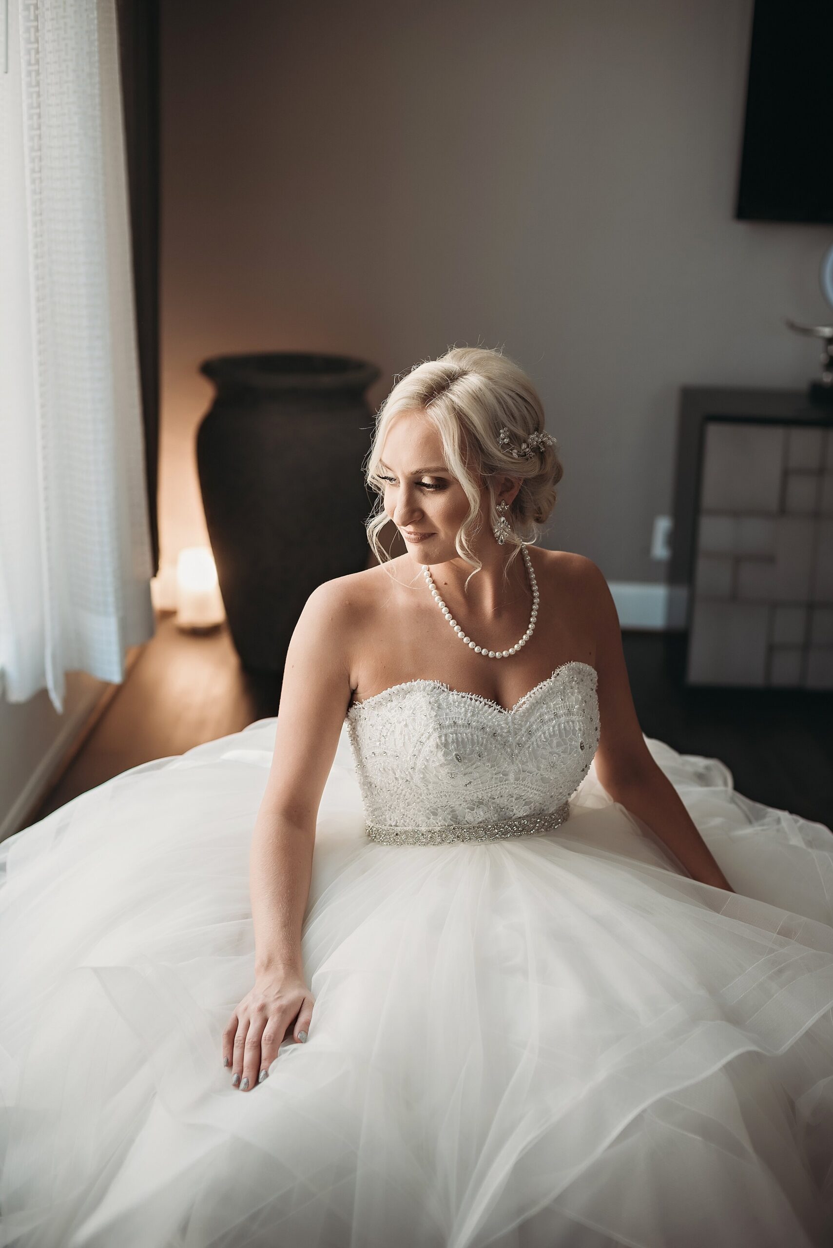 bridal portrait in wedding suite in ballroom gown