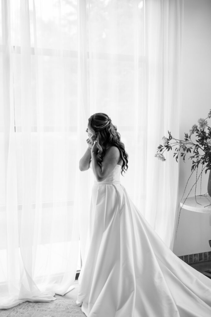 Bride getting ready in natural light at The Atrium at Blue Haven
