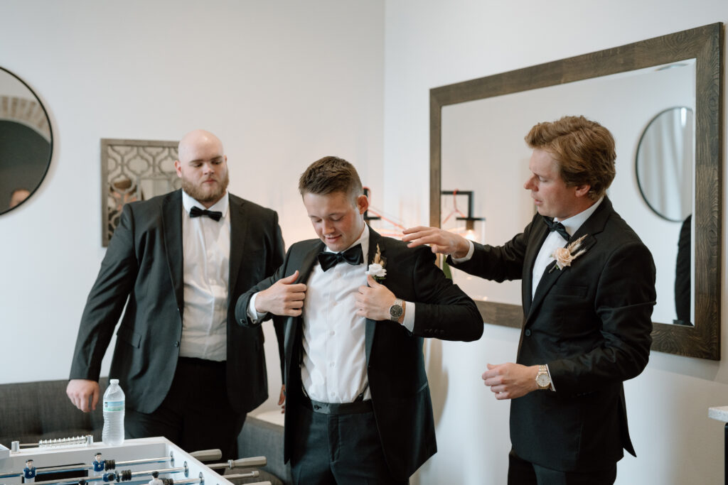 Groom preparing for wedding day at The Atrium at Blue Haven