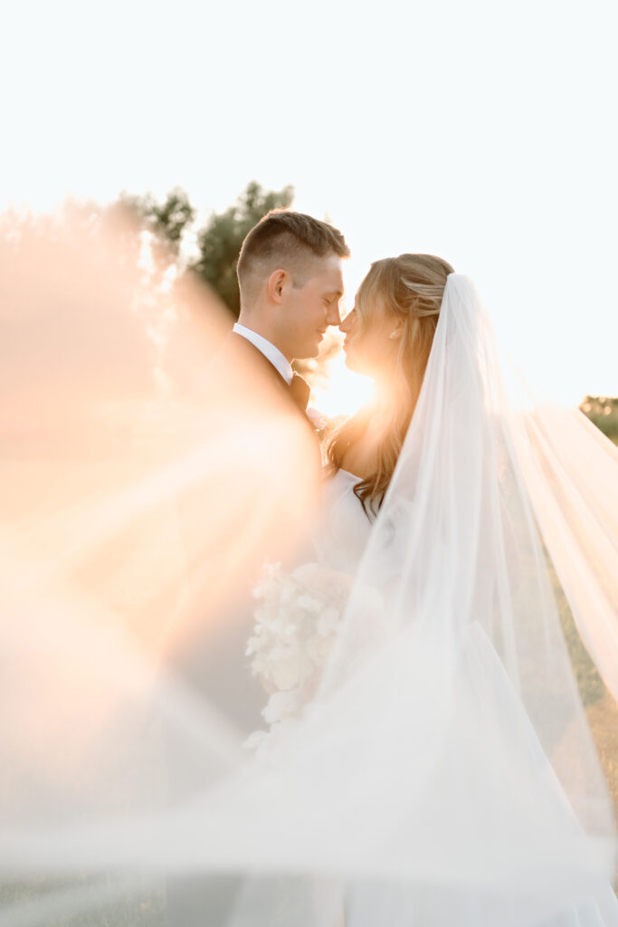 Bride and groom standing together at The Atrium at Blue Haven