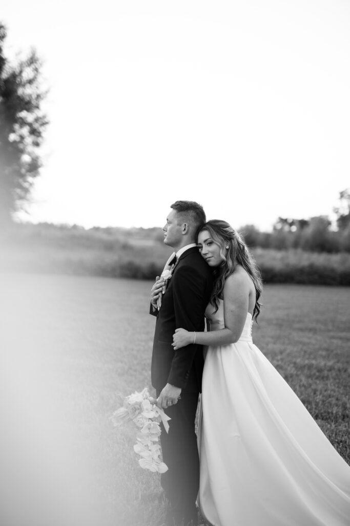Wedding couple posing together at The Atrium at Blue Haven
